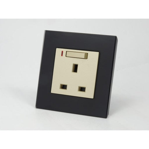 Black glass single frame and gold insert UK socket with switch and neon