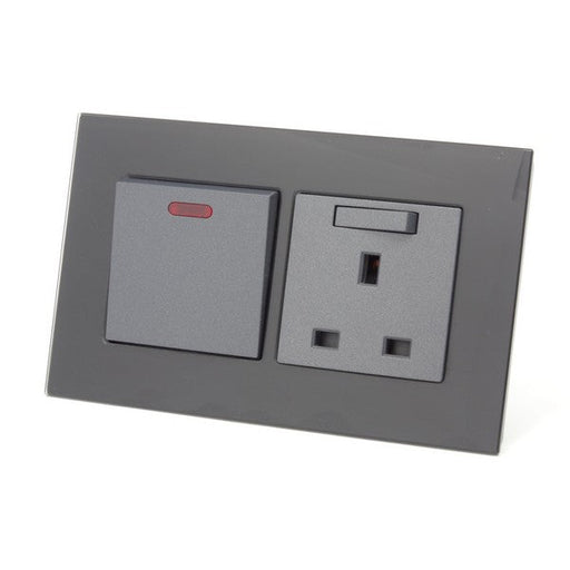 black glass double frame with grey modules of a switch and a switch UK socket