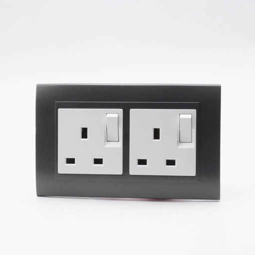 Dark Grey Plastic Arc Double Frame with white Interests of both Switched UK sockets