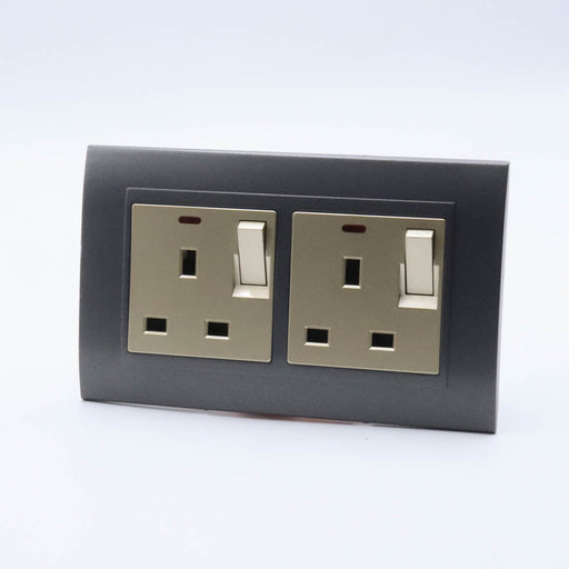 Dark Grey Plastic Arc Double Frame with gold Interests of both Switched neon UK sockets