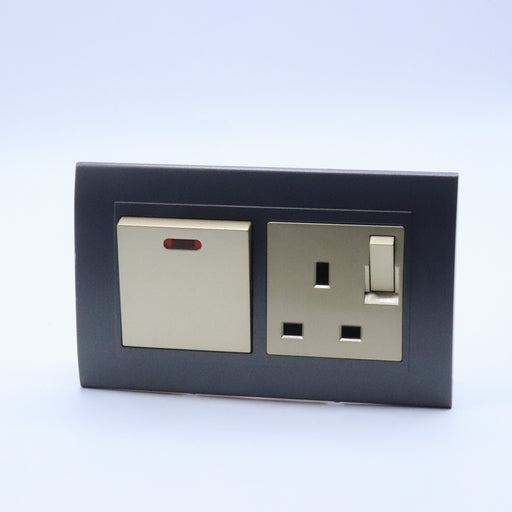 Dark Grey plastic with arc double frame with gold inserts of 20a switch and switched uk socket