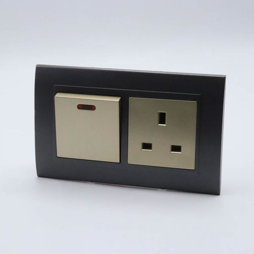 Dark Grey plastic with arc double frame with gold inserts of 20a switch and uk socket