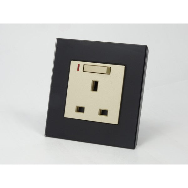 Black glass single frame and gold insert UK socket with switch and neon