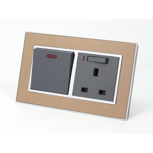 Satin Gold metal double frame with Dark Grey inserts switch with neon and switched neon uk socket