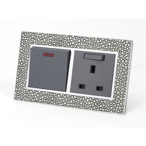 pearl leather double frame with grey insert of double switch and switched UK socket