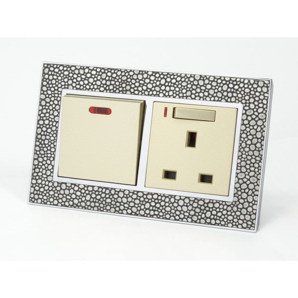 pearl leather double frame with gold insert of double switch and switched neon UK socket