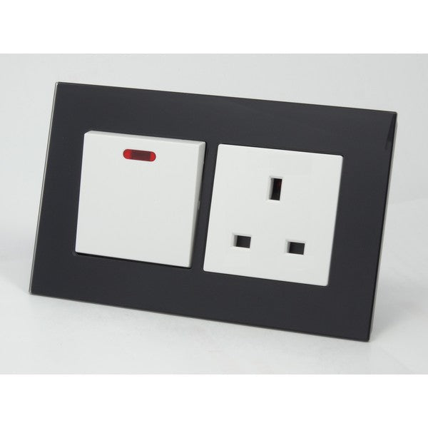 black glass double frame with white modules of a switch and a UK socket