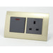 Gold Plastic Double Frame with dark grey insert of switch and uk socket