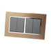 Gold Satin Metal Double Frame with dark grey insert of 4 gang light switches