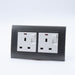 Dark Grey Plastic Arc Double Frame with white Interests of both Switched neon UK sockets