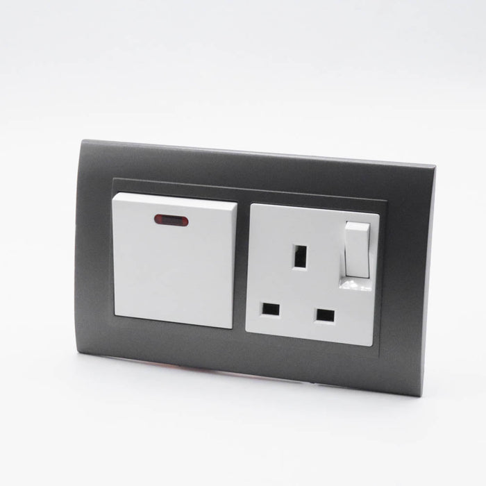 Dark Grey plastic with arc double frame with white inserts of 20a switch and switched uk socket