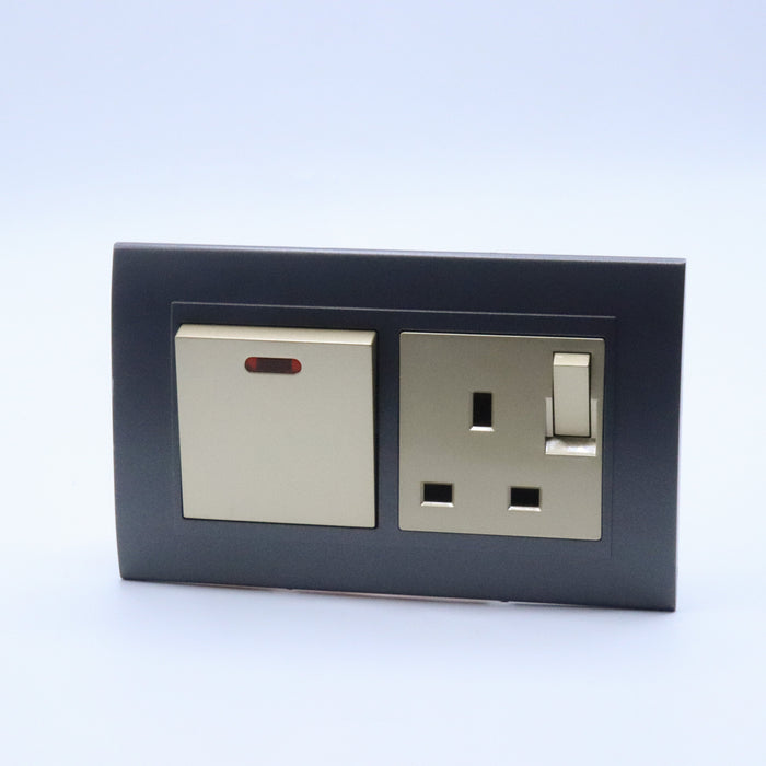 Dark Grey plastic with arc double frame with gold inserts of 45a switch and switched uk socket